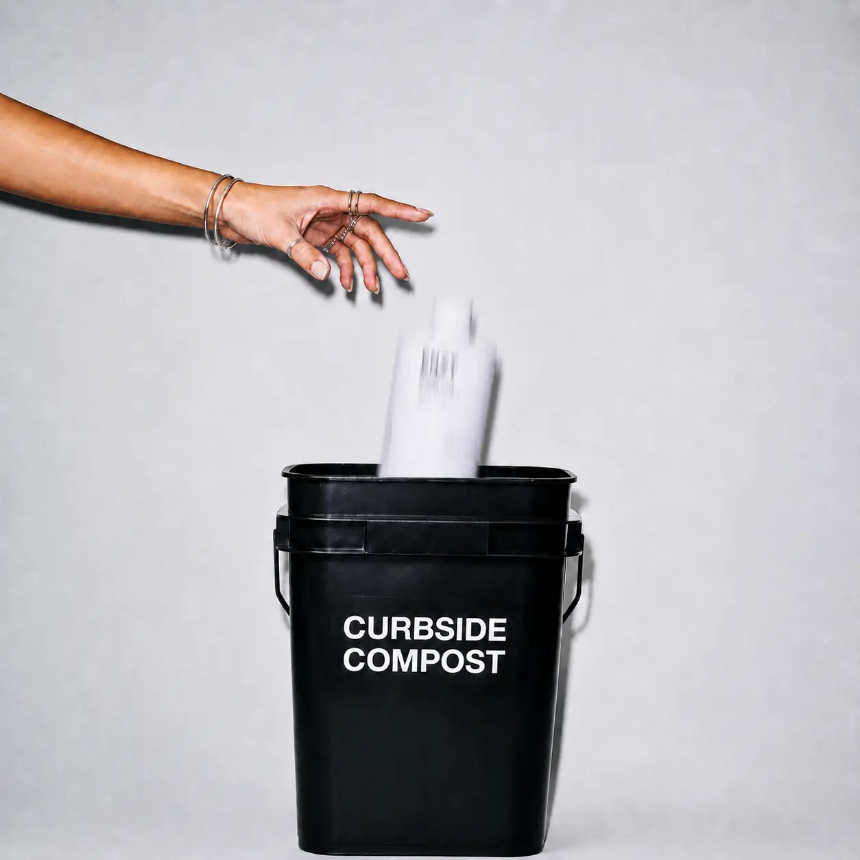 Enzy tossed into curbside compost bucket